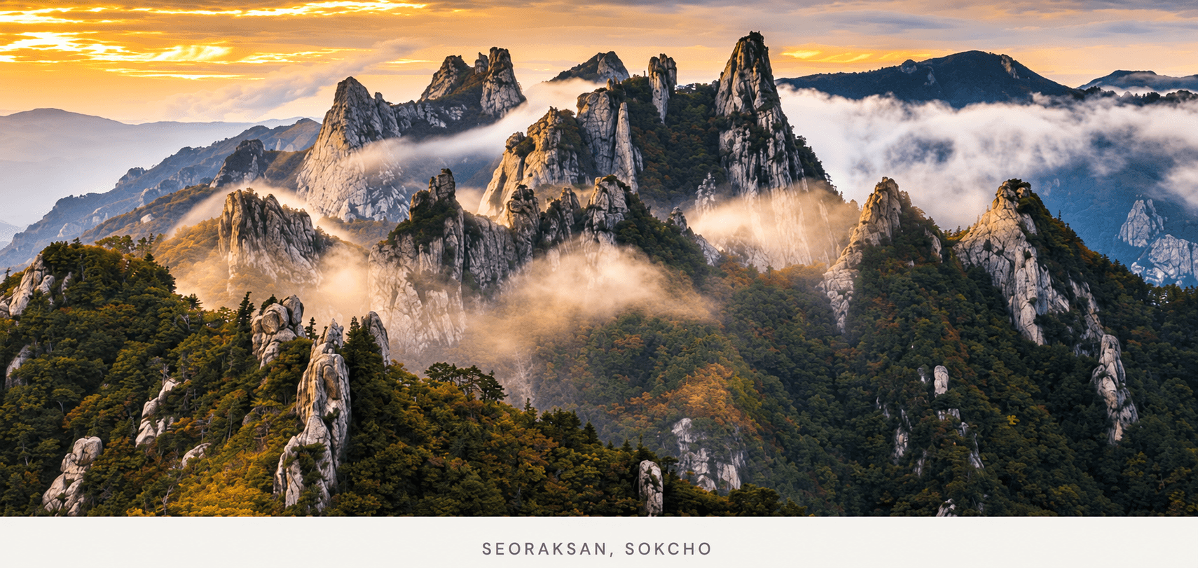 Granite peaks of Seoraksan rising above wooded slopes under a summer sky in Sokcho