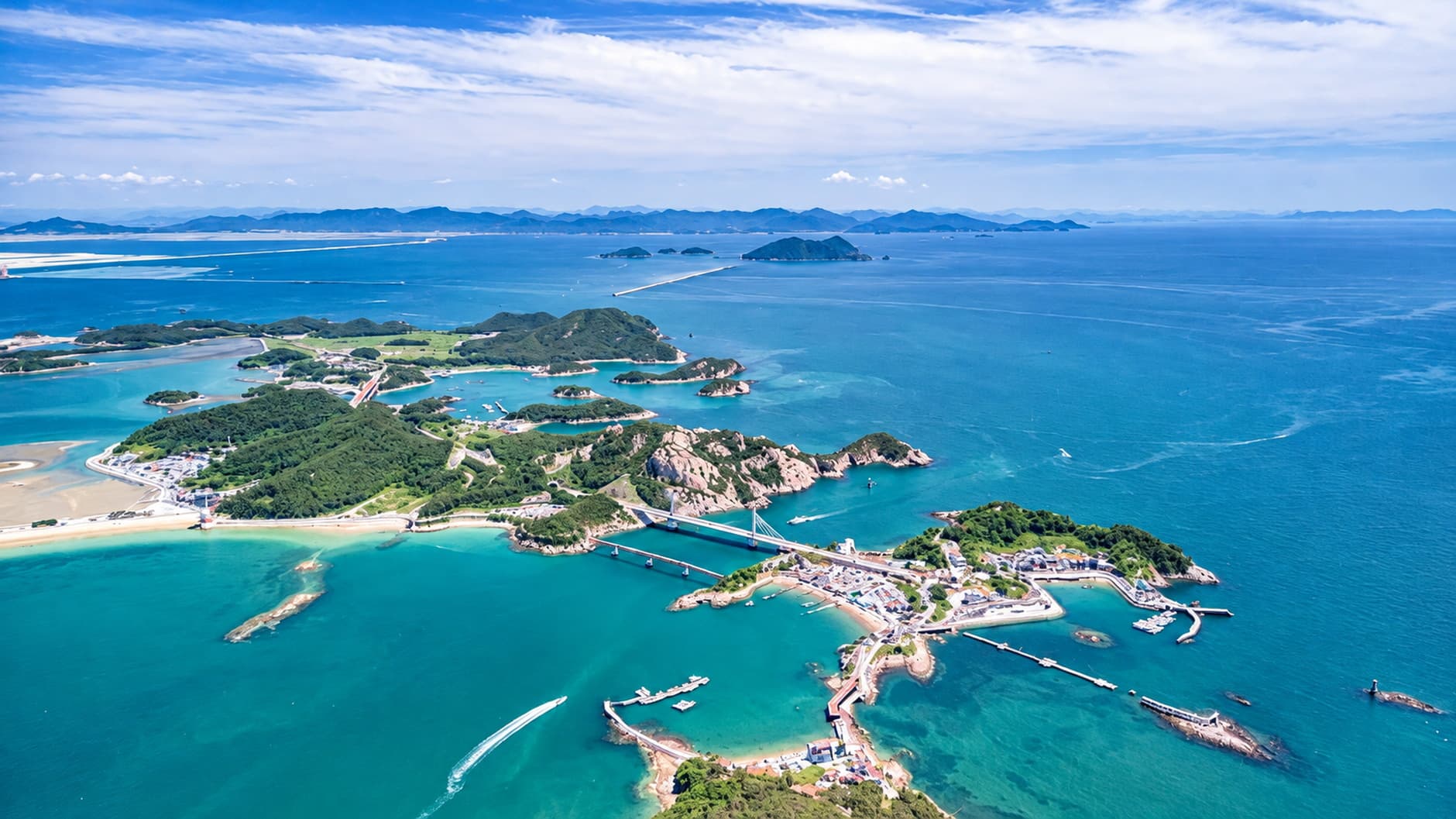 Small green islands in turquoise water off the Gunsan coast.