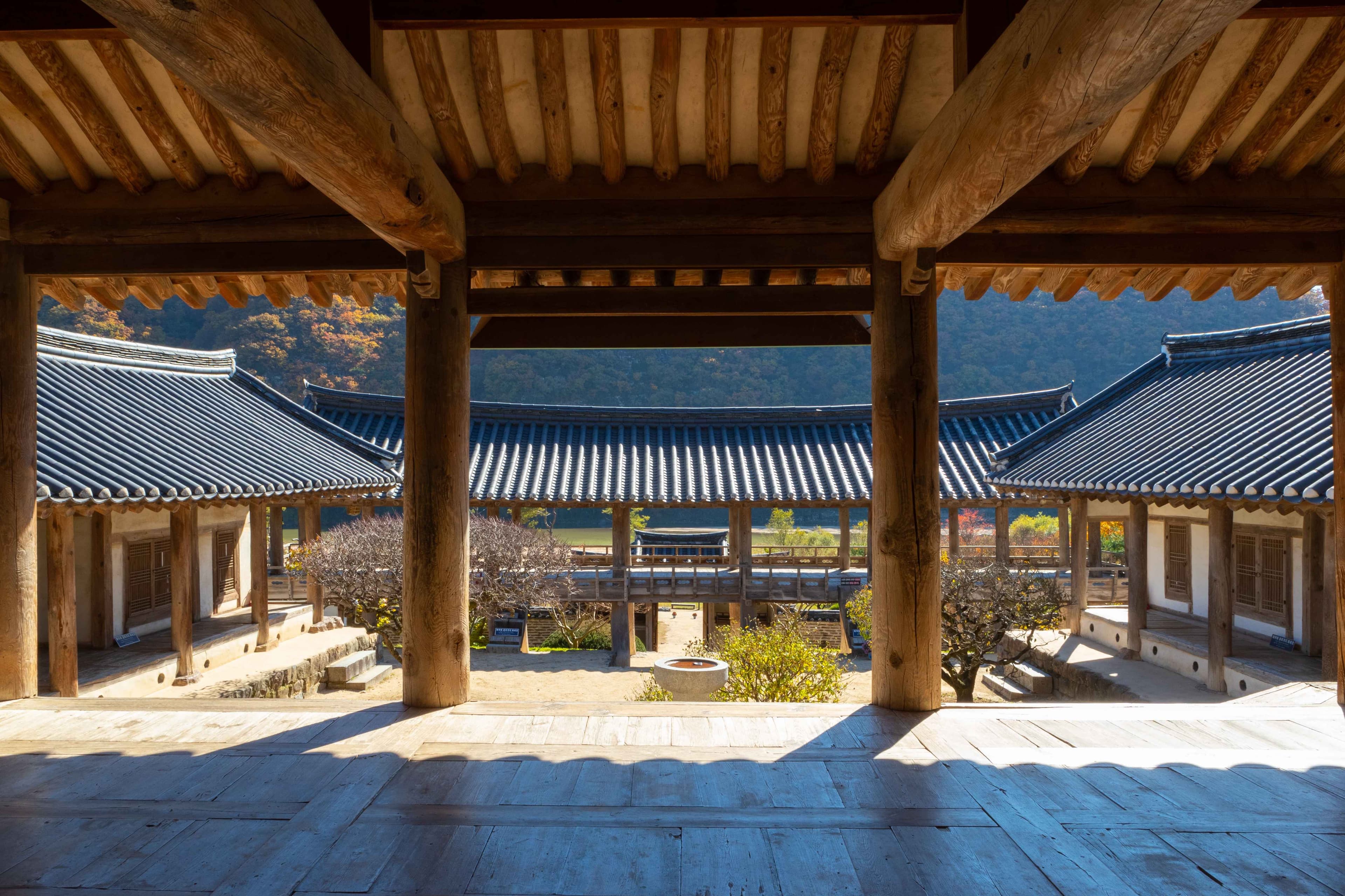 The wooden courtyard and tiled roofs of Byeongsan Seowon in Andong, seen from the hall.