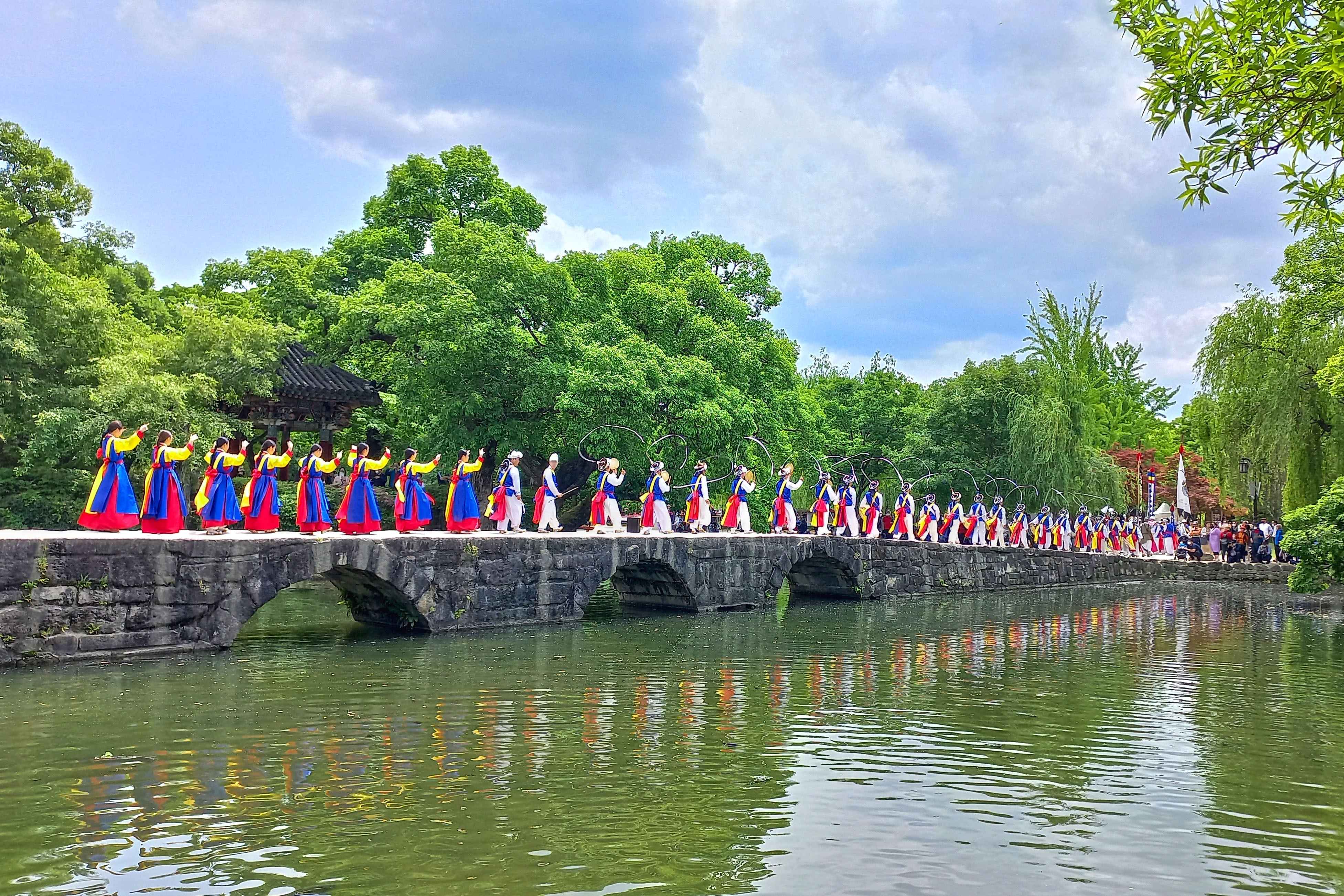 A stone bridge and pond pavilion at Gwanghalluwon Garden in Namwon.